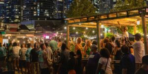 Crowd of people at an outdoor patio at night