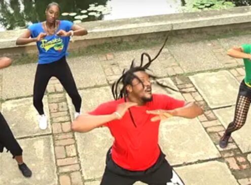 A group of people exercising outdoors.