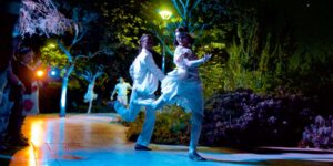 Two dancers dancing at night outside