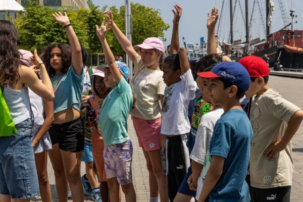 A group of children participating in an outdoor class
