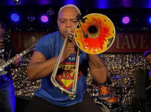 A live band against a dark background