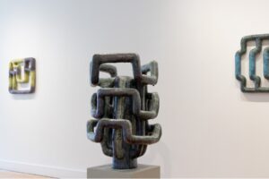 An up-close shot of a ceramic work in a gallery