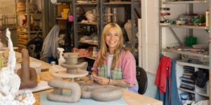 Artist working on ceramic craft in studio