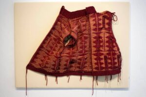 An up-close shot of a red textile work