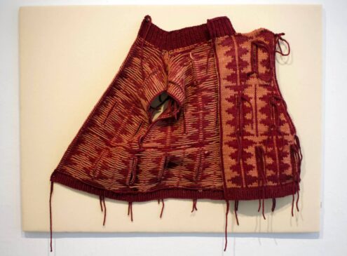 An up-close shot of a red textile work