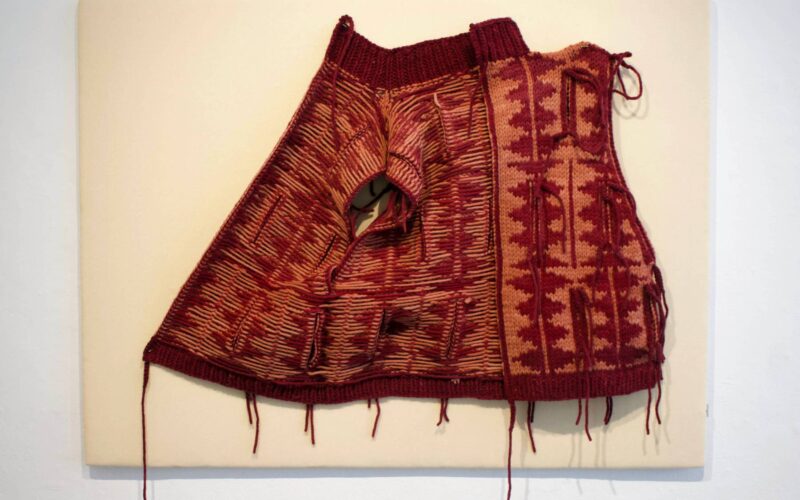 An up-close shot of a red textile work