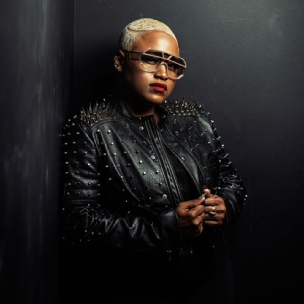 A woman wearing a black leather jacket