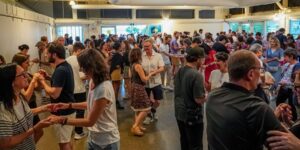A crowd of people dancing in a room