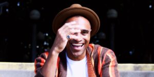 A man wearing a hat and posing for the camera