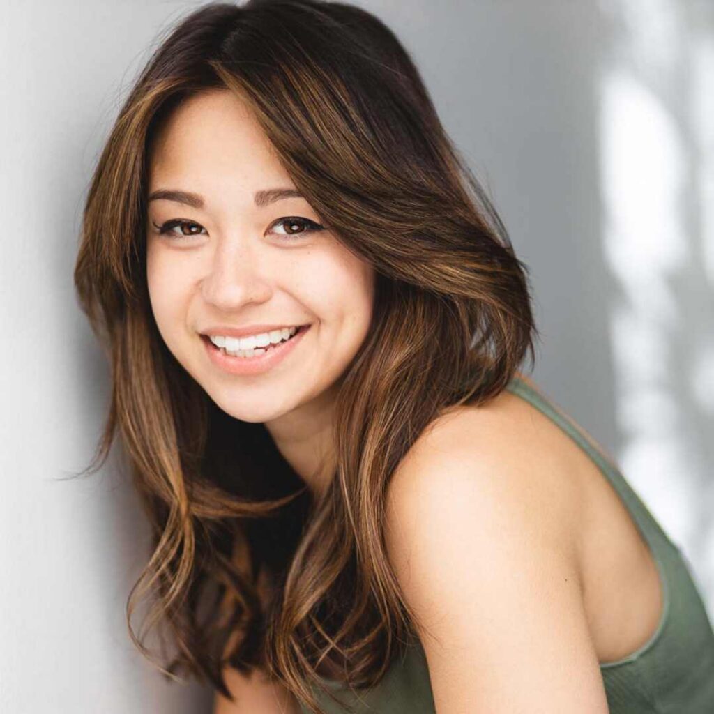 A headshot of a woman smiling