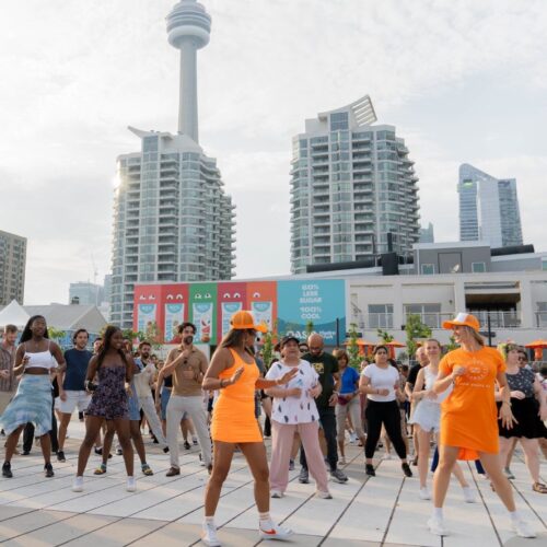 People dancing at an outdoor square at Harbourfront