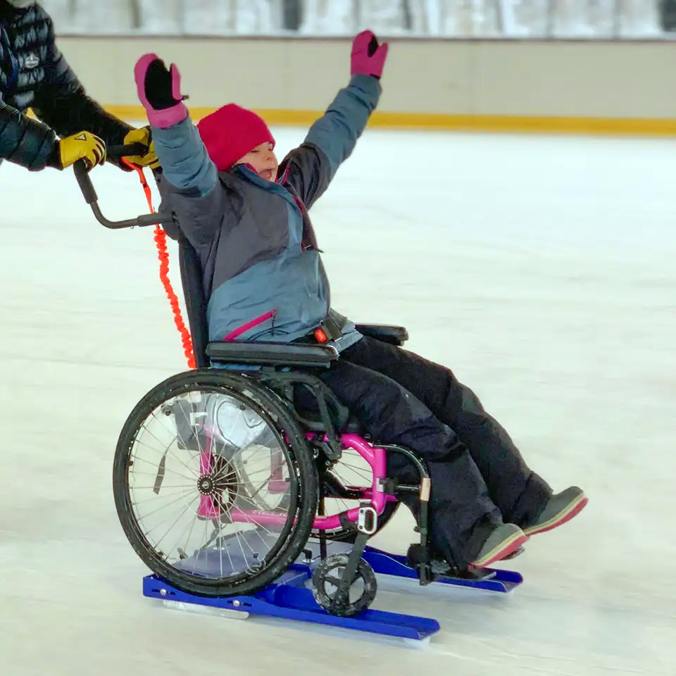 A young person in a wheelchair using the Lugicap Ice Perf