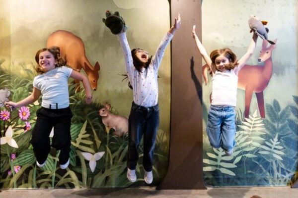 A group of children jumping mid-air