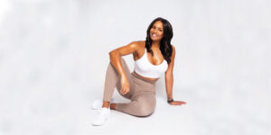A woman wearing exercise clothes posing for the camera