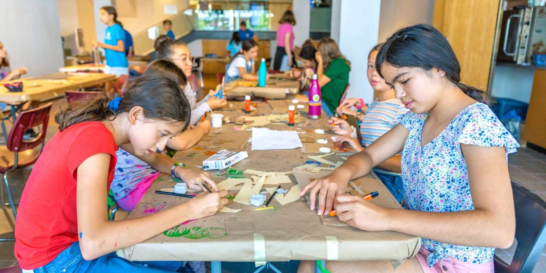 Group of girls doing arts and crafts at camp