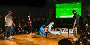 A crowd watching breakdancers