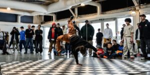 A crowd watching breakdancers