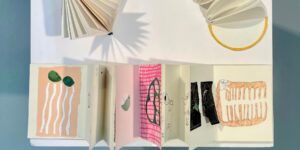 A graphic of paper and books