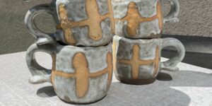 Stacks of ceramic mugs on a table