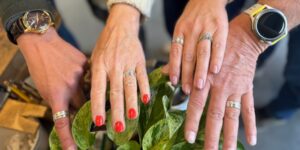 Multiple hands posing with rings