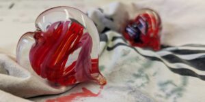 Glass ornament in the shape of a heart and coloured red
