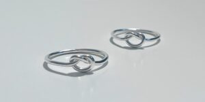 A close-up shot of two silver rings