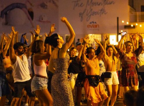A group of people dancing outside