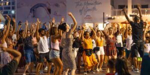 A group of people dancing outside