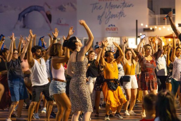 A group of people dancing outside