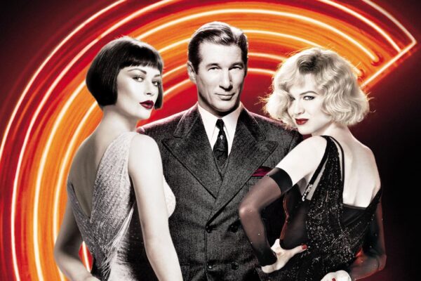 A Chicago movie poster with man in a suit next to two women against a bright orange lighted background