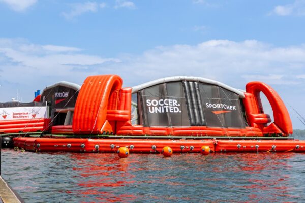 Inflatable floating soccer pitch on water