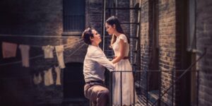 West Side Story film poster with a couple facing each other on a balcony.