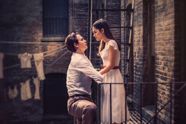 West Side Story film poster with a couple facing each other on a balcony.