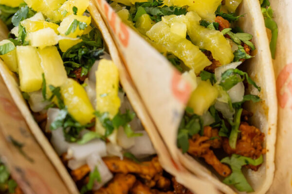 tasty looking tacos in paper wrapping