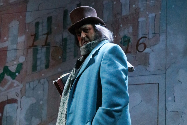 Ebenezer Scrooge in a blue coat