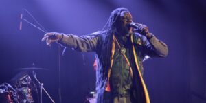 A musician singing on stage