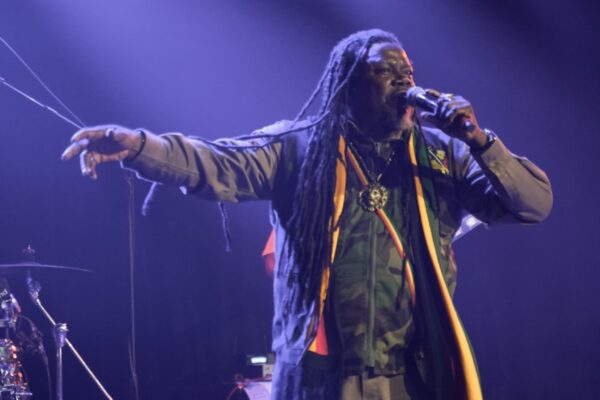 A musician singing on stage