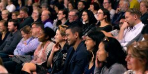 An audience watching a show in a theatre