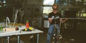 An artist blowing glass