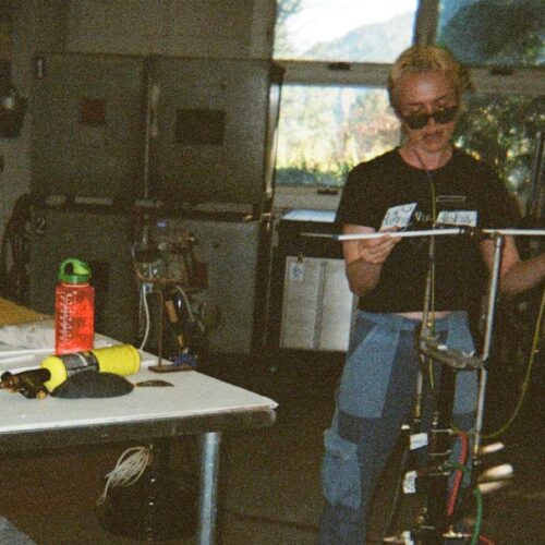 An artist blowing glass