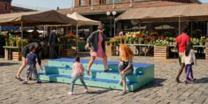 Group of people interacting with an art installation