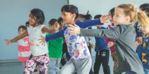 A group of girls dancing in a dance class