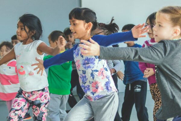 A group of girls dancing in a dance class