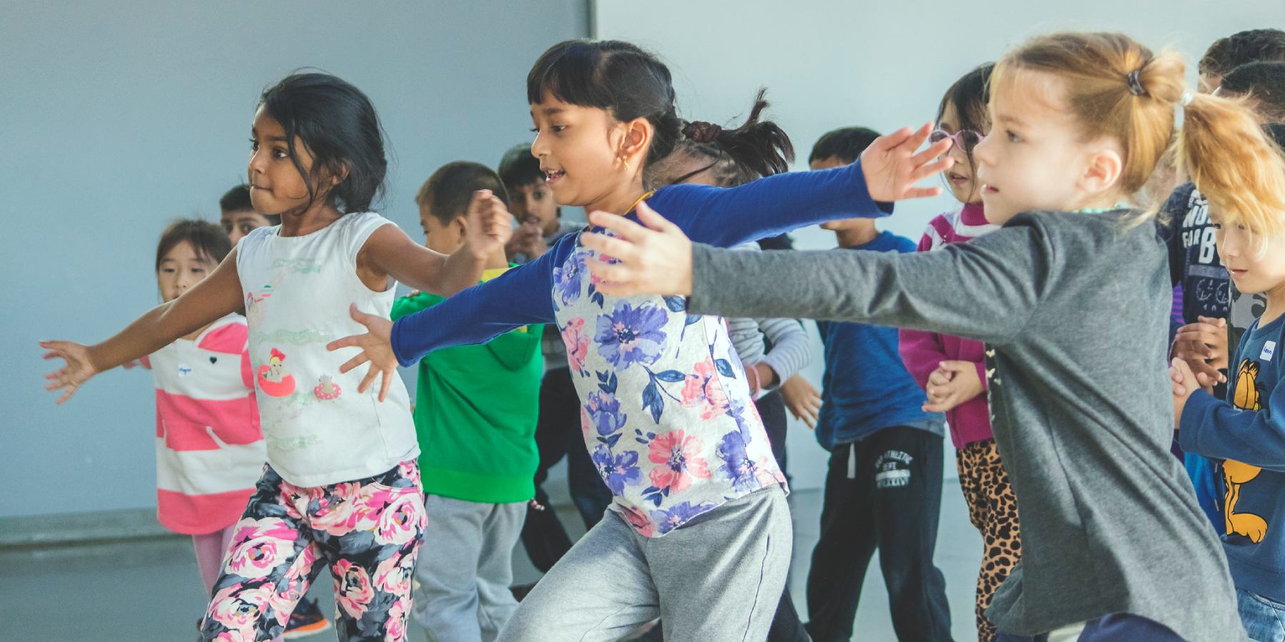 A group of girls dancing in a dance class