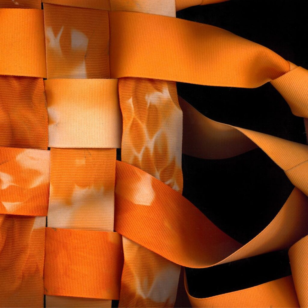 A close-up shot of an orange ribbon pattern