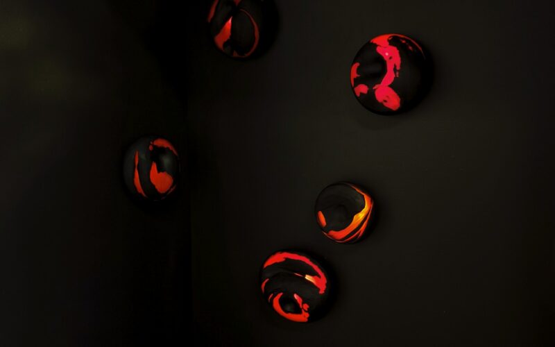Glowing red lamps in a dark black background