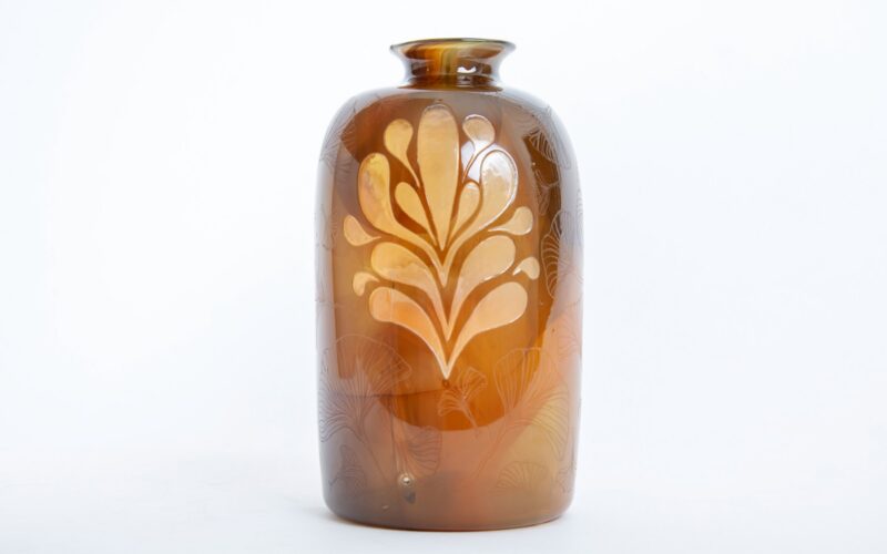 Orange coloured glass vase with pattern