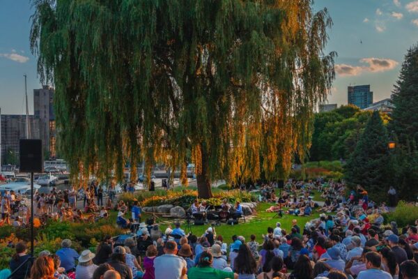 Outdoor music garden performance in front of a crowd
